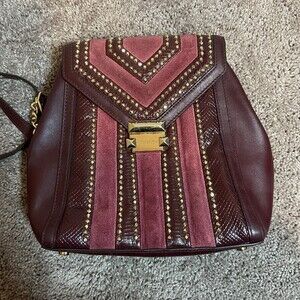 Michael Kors Chic Burgundy Women's Backpack with gold accents